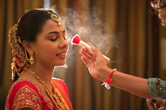 "A professional makeup artist at Shrees Beauty Parlour in Kathreguppe, Banashankari 3rd Stage, Bengaluru, creating a stunning makeup look."