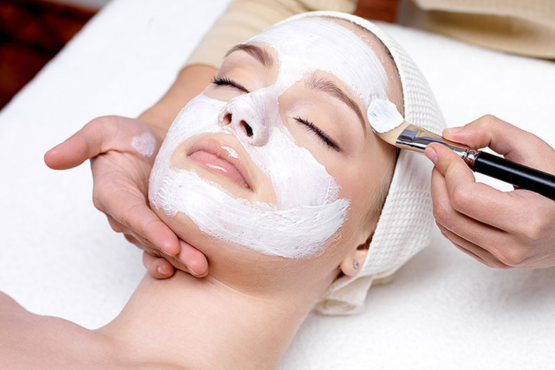 A professional beautician at Shrees Beauty Parlour in Kathreguppe, Banashankari 3rd Stage, Bengaluru, performing a facial treatment on a client."